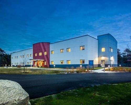 Nighttime photo of Cape Cod UPH building exterior